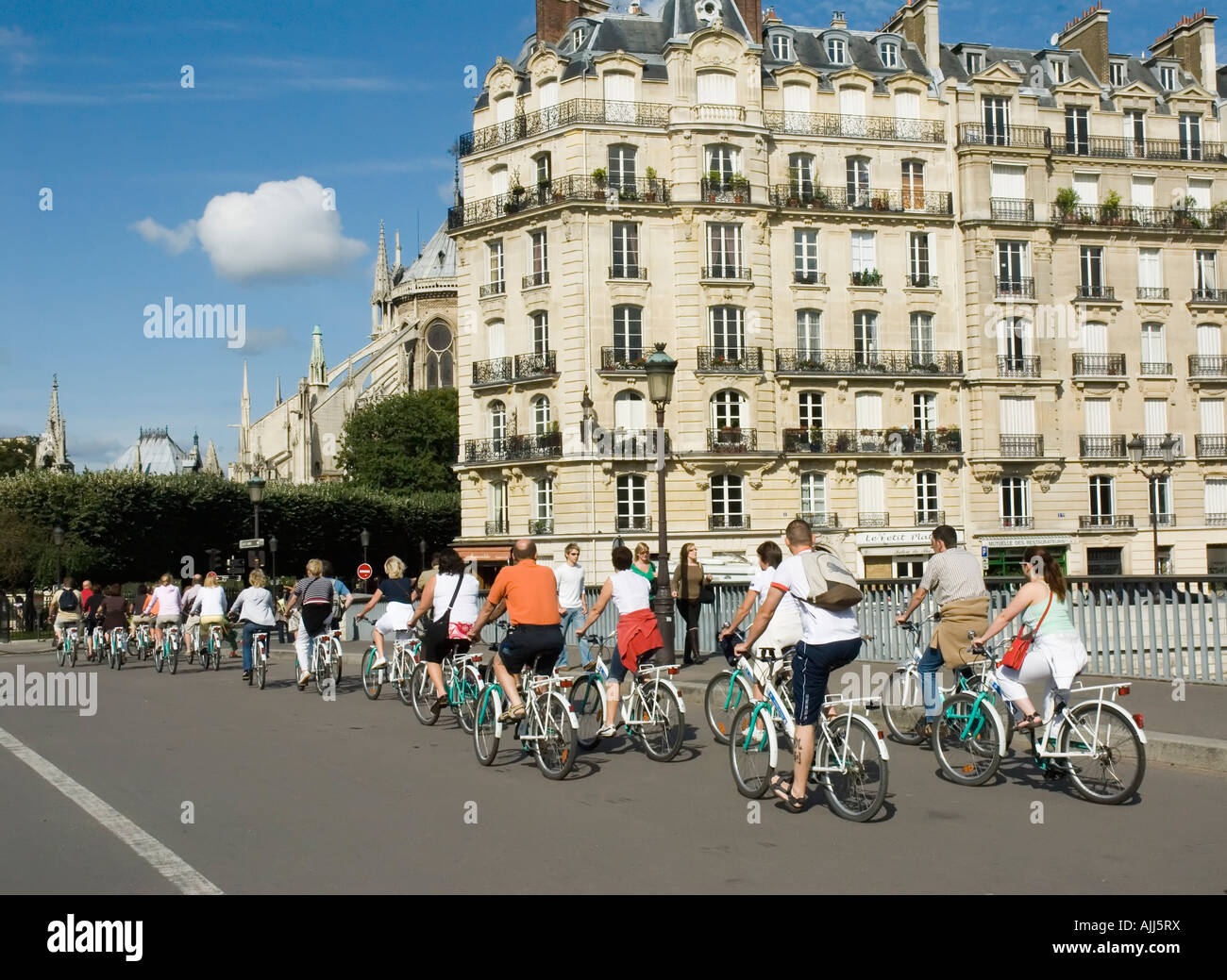 City tour of Paris by bicycle alongside the Seine Ille de la Cite Stock ...