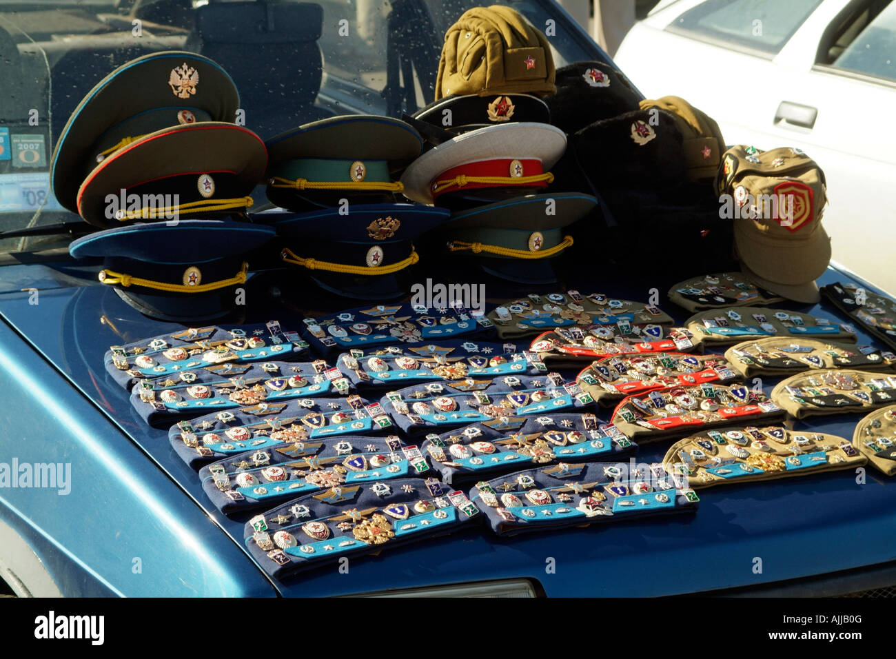Russian Military Hats Caps and Badges for Sale from the bonnet of a car in  St Petersburg tourists area Stock Photo - Alamy