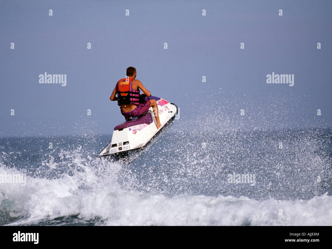 Jet ski jumping over wave Stock Photo Alamy