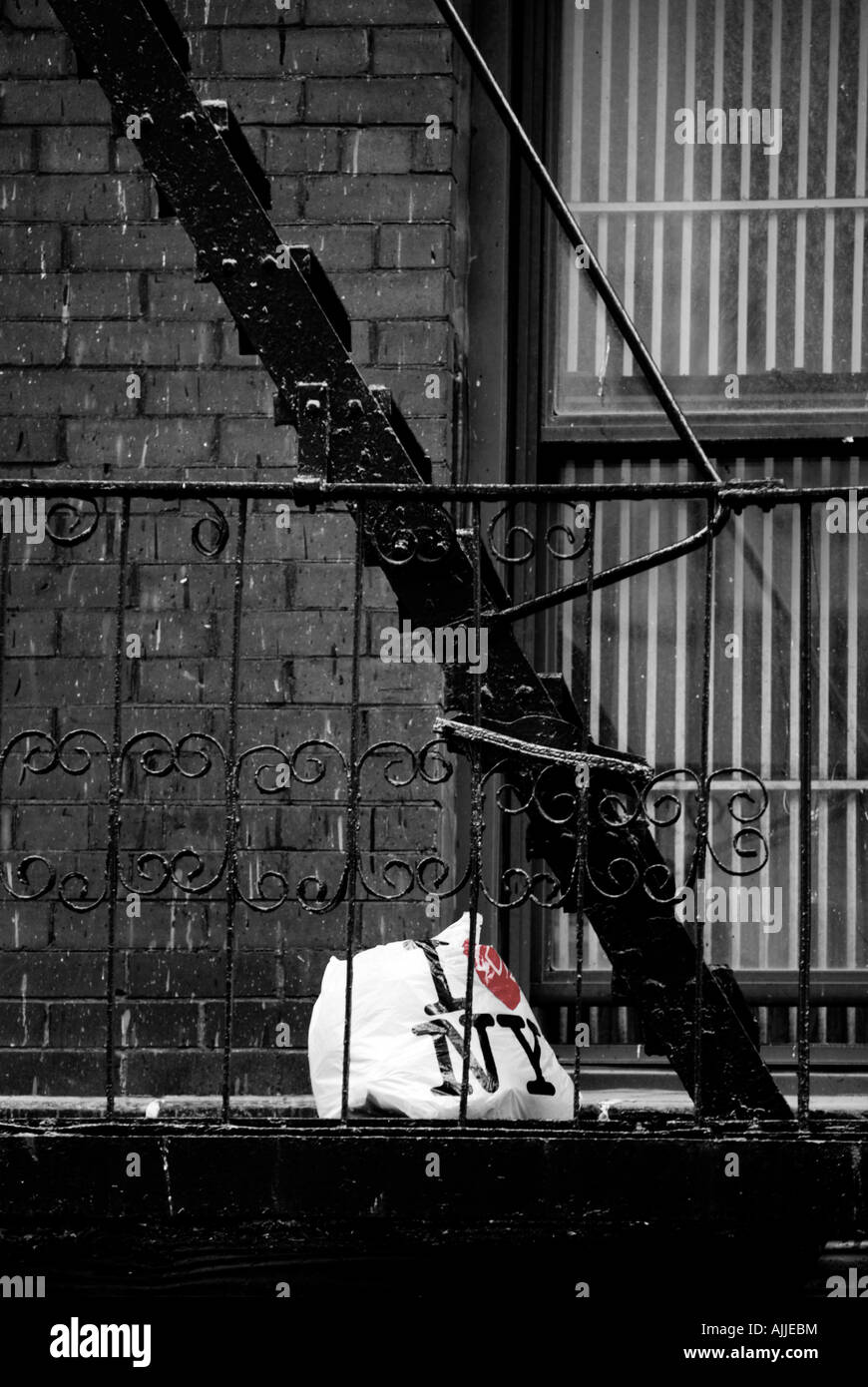 Abandoned shopping bag on NY fire escape Stock Photo