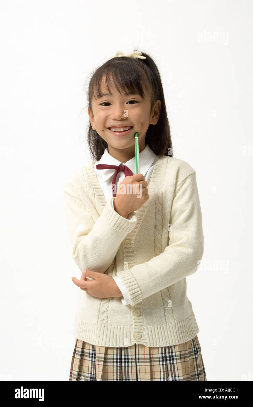 Portrait of elementary age girl standing Stock Photo