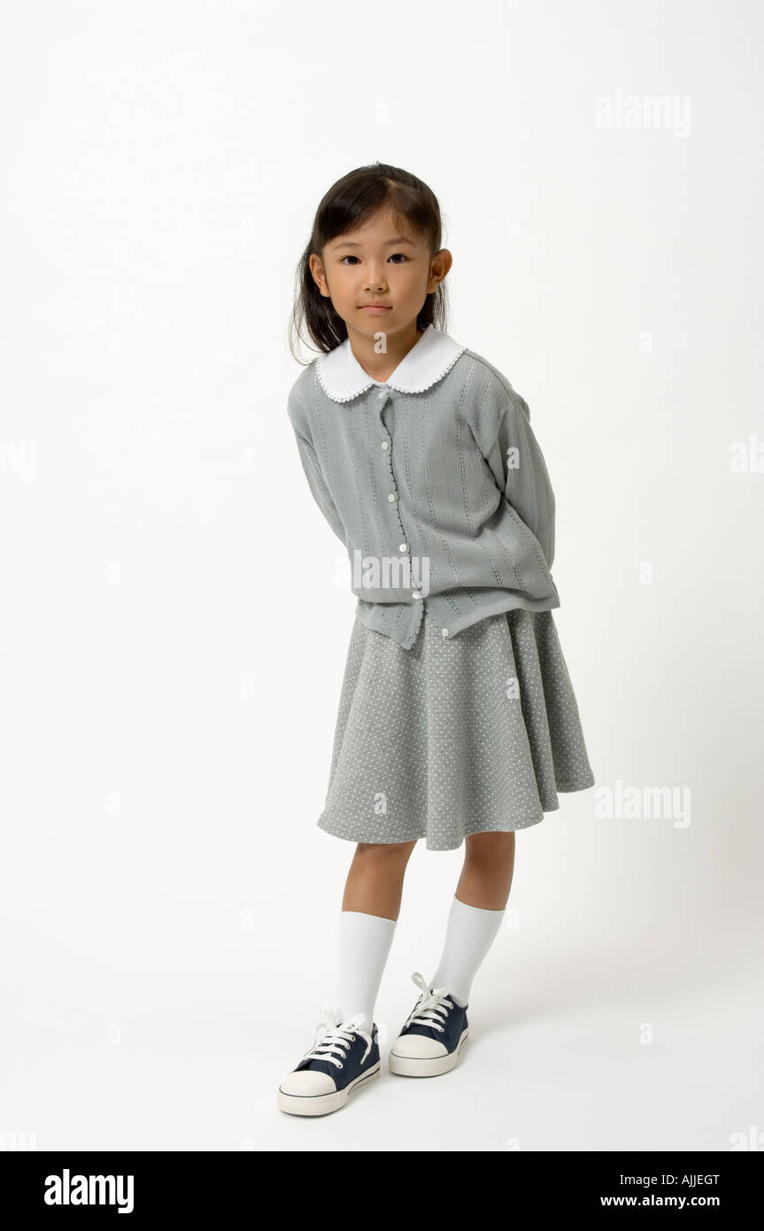 Elementary age girl standing Stock Photo