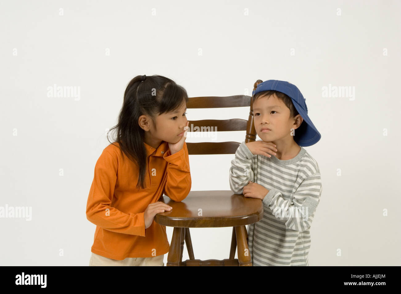 Two elementary age children standing Stock Photo - Alamy