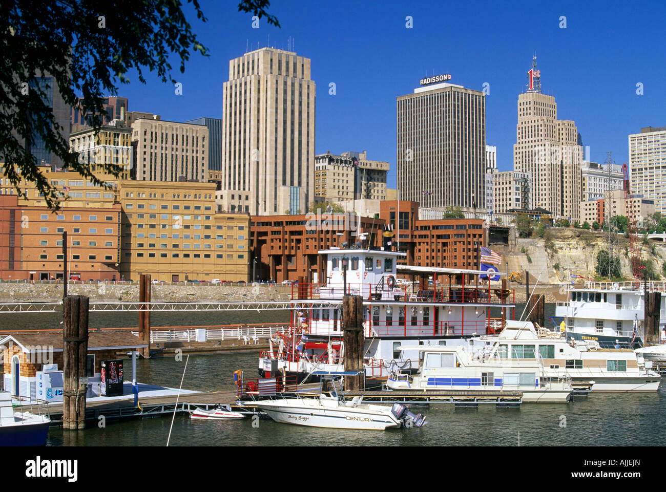 SKYLINE OF ST. PAUL, MINNESOTA AND THE MISSISSIPPI RIVER WITH WATERCRAFT DOCKED.  SUMMER. Stock Photo