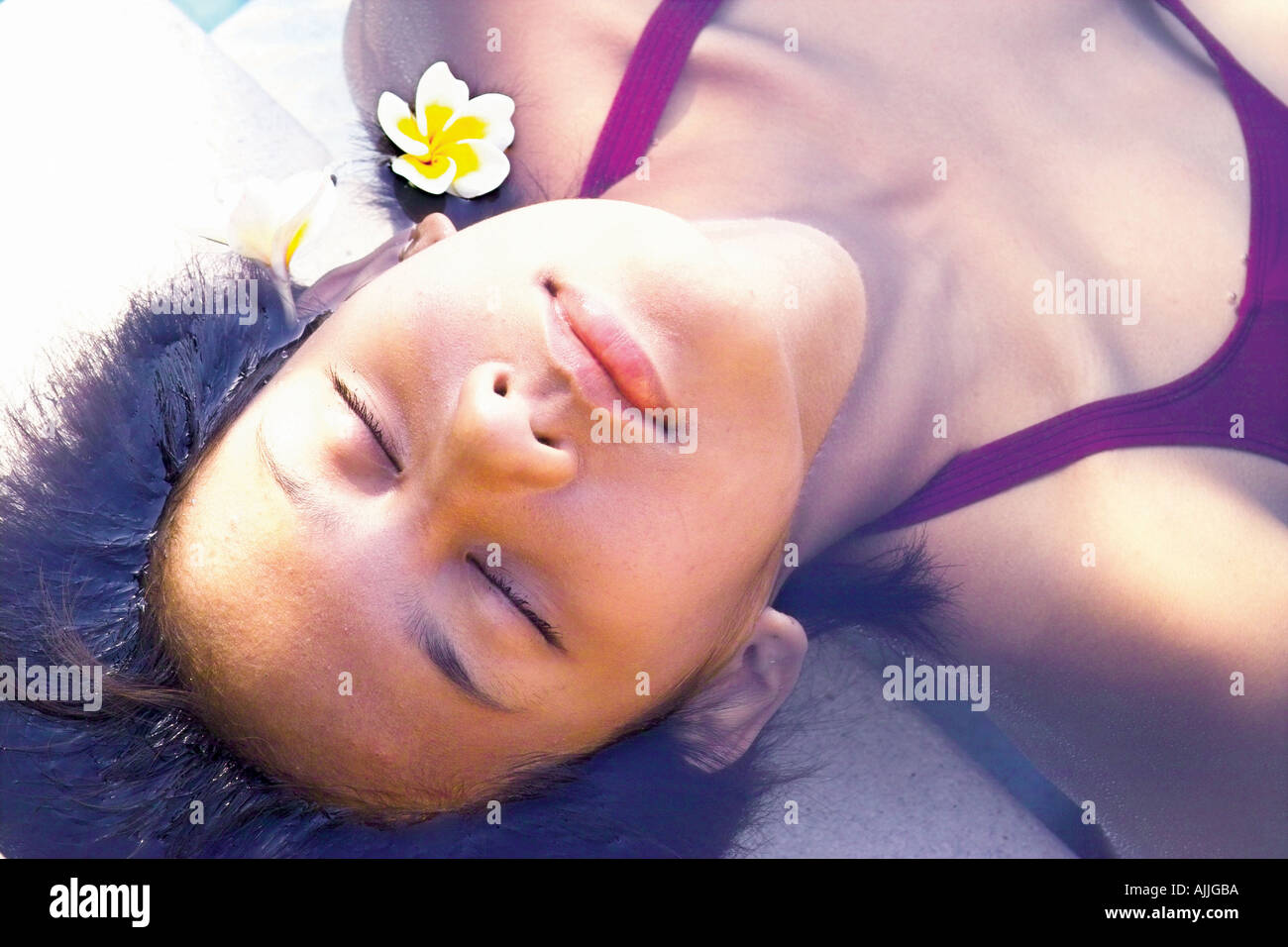 High angle view of a young woman lying in water Stock Photo - Alamy