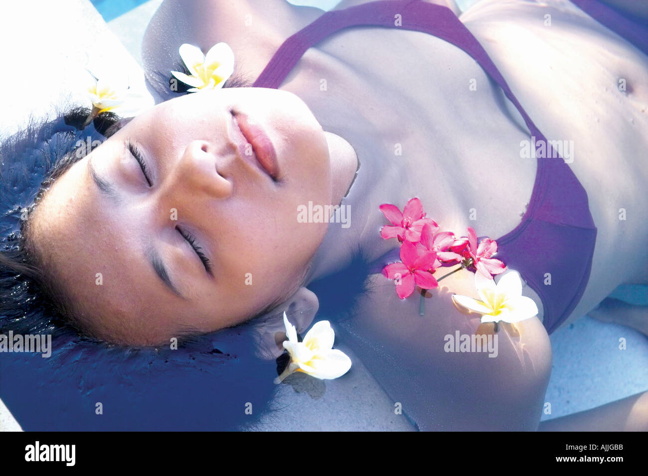 High angle view of a young woman lying in water Stock Photo - Alamy