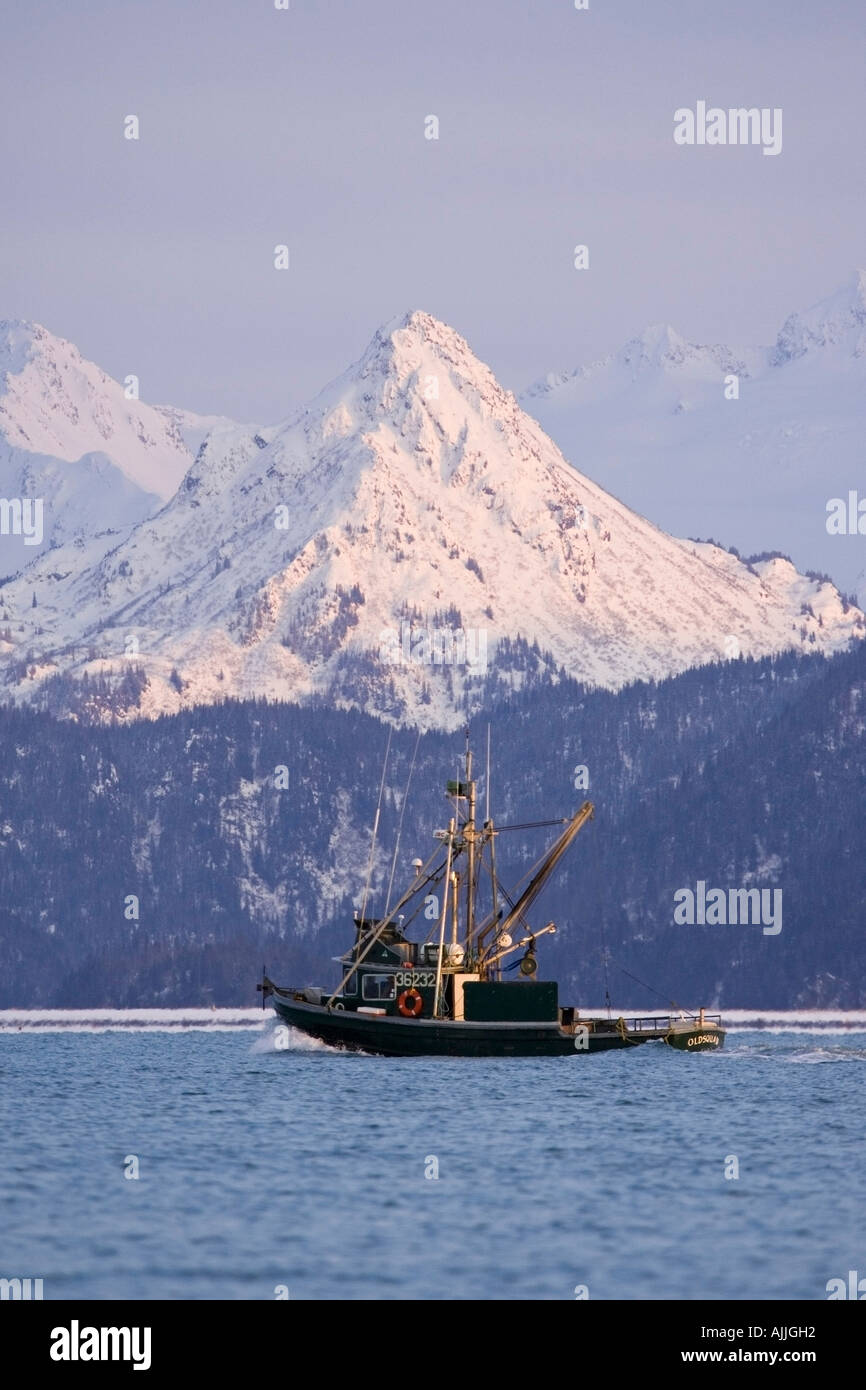 Commercial fishing boat in Kachemak Bay w snow covered Kenai Mtns Poots