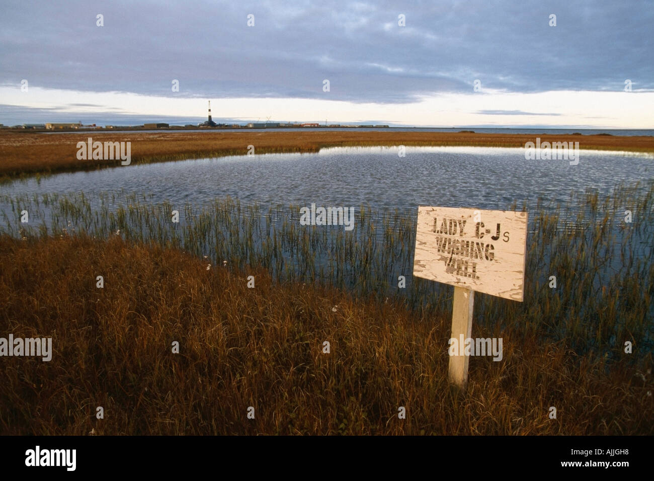 Drilling rig along coastal wetlands of Prudhoe Bay Beaufort Sea Arctic Alaska Autumn w sign post Stock Photo