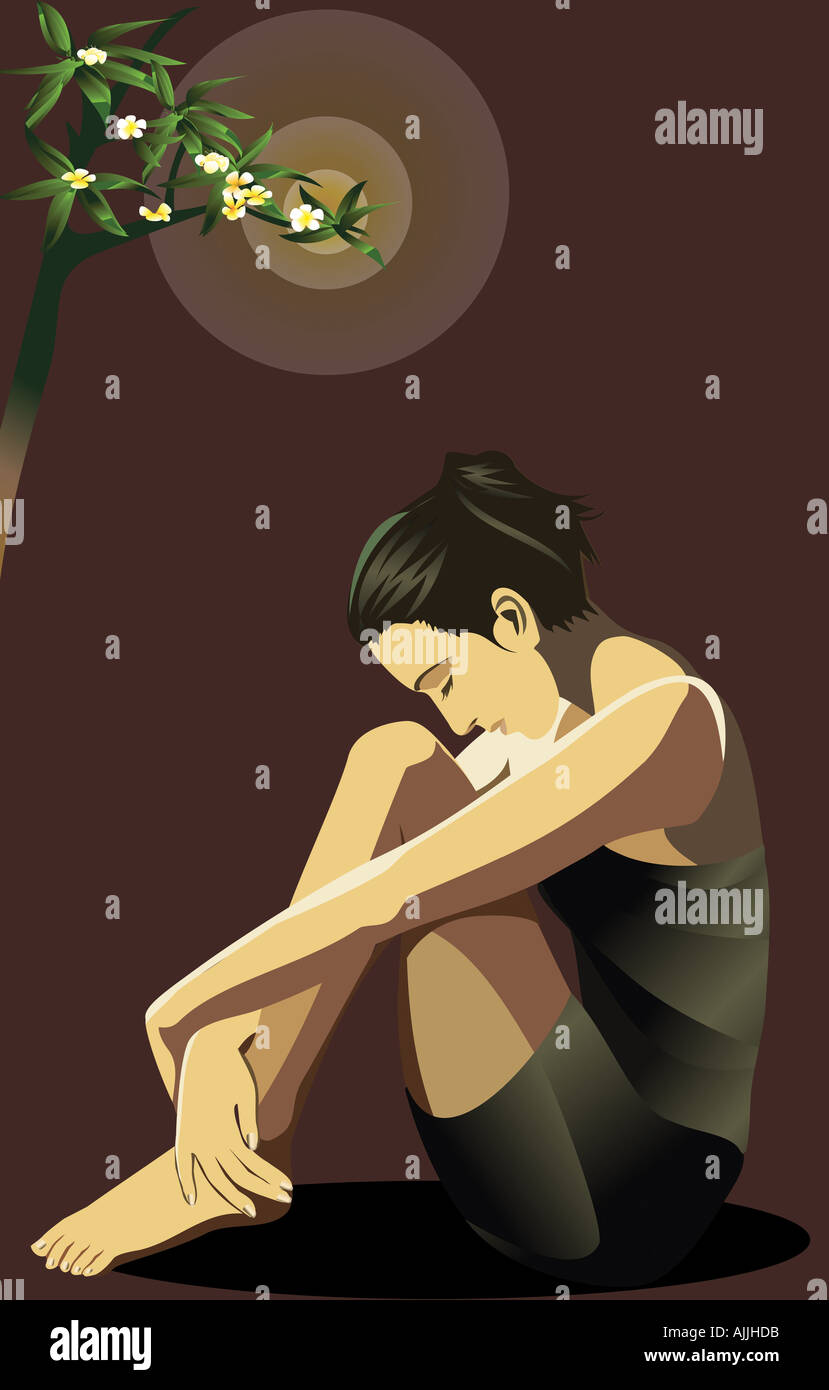 Side profile of a young woman hugging her knees Stock Photo - Alamy