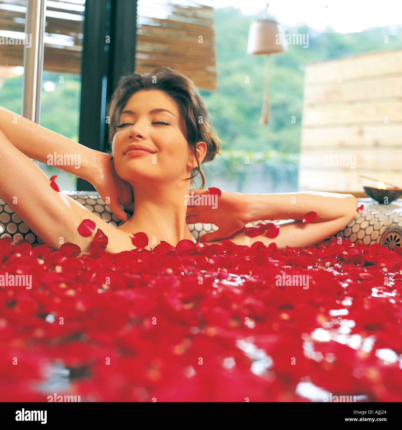 Woman in bathtub petals hi-res stock photography and images - Alamy