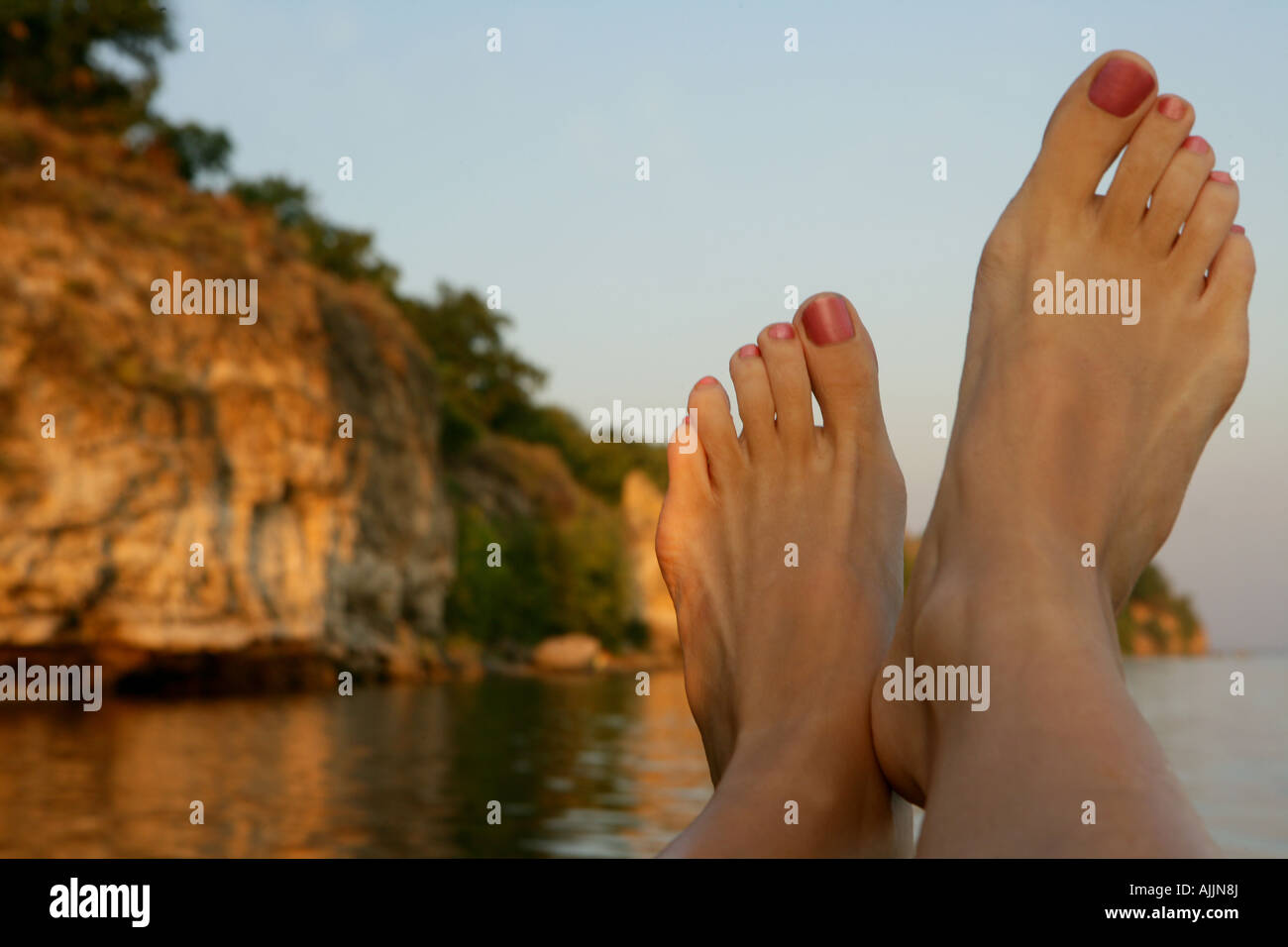 Vacation in Russia. Volga River. Feet up on the boat Stock Photo