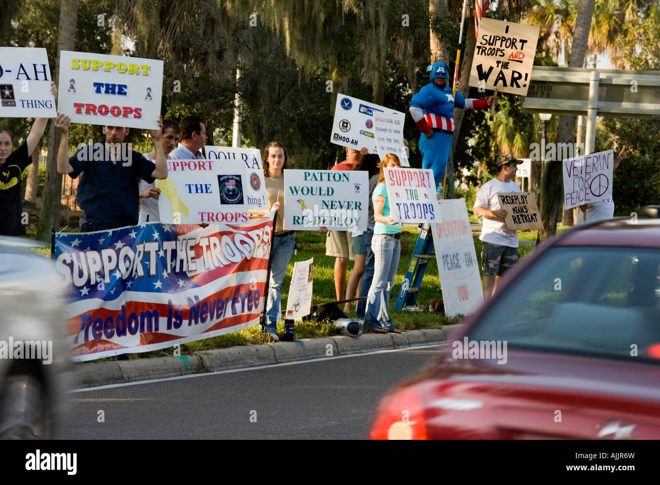 Supporters of the war in Iraq standing on an intersection in the Tampa Bay Area october 2007 Stock Photo