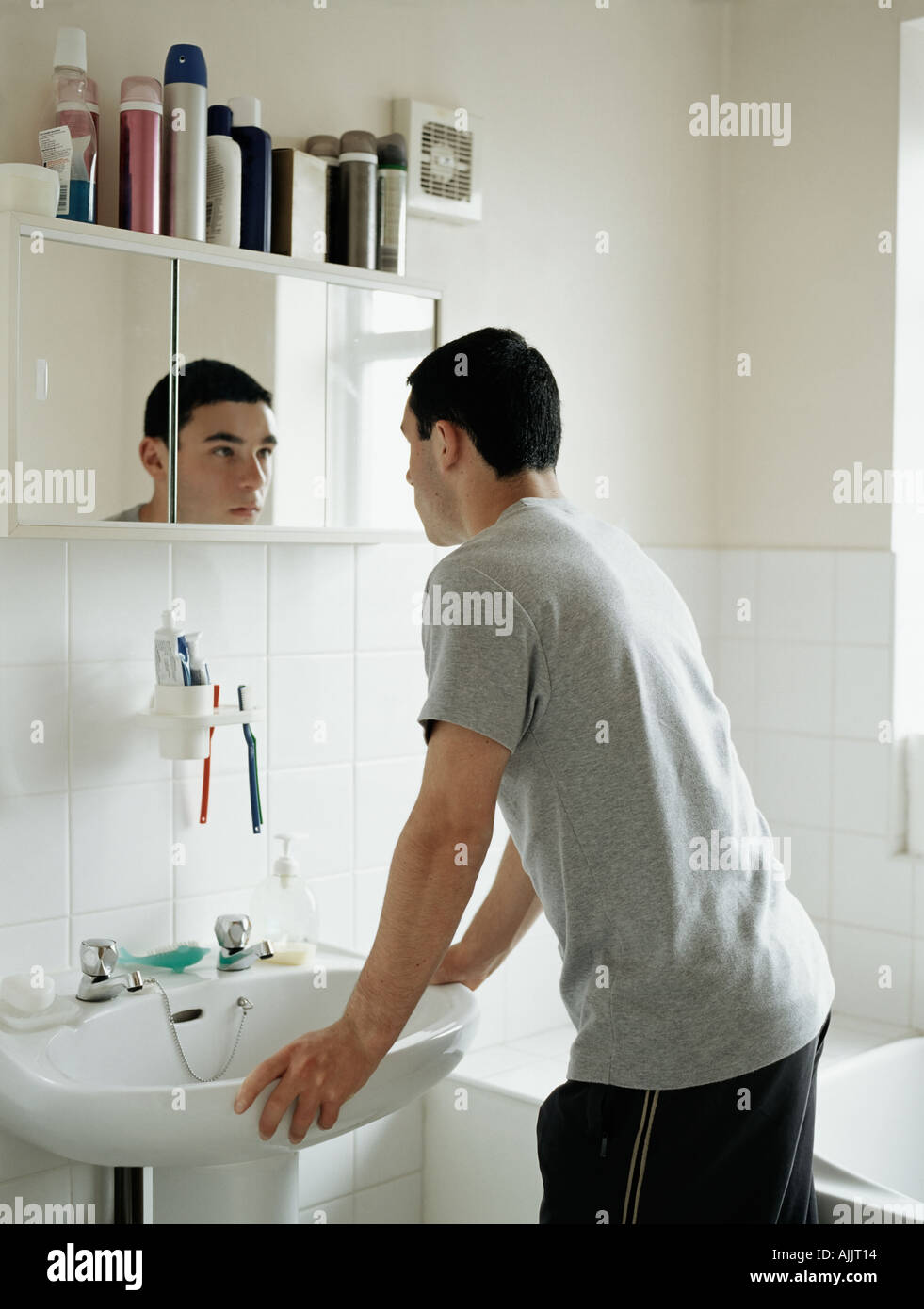 teenage boy standing in bathroom stock photo 4816915 alamy
