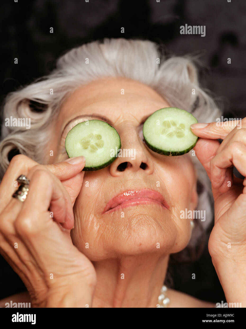 Woman Holding A Cucumber High Resolution Stock Photography and Images