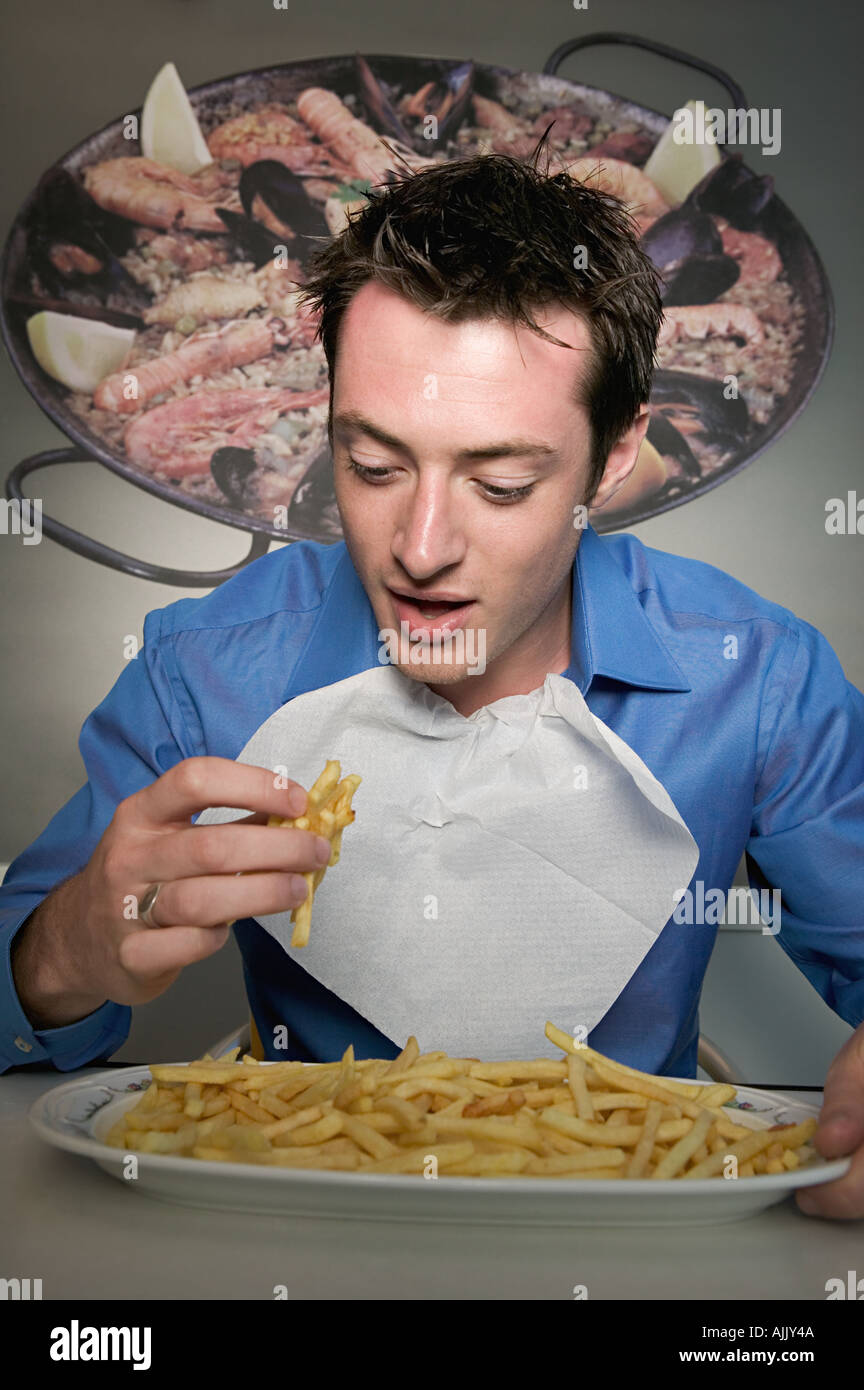 Man eating french fries Stock Photo Alamy