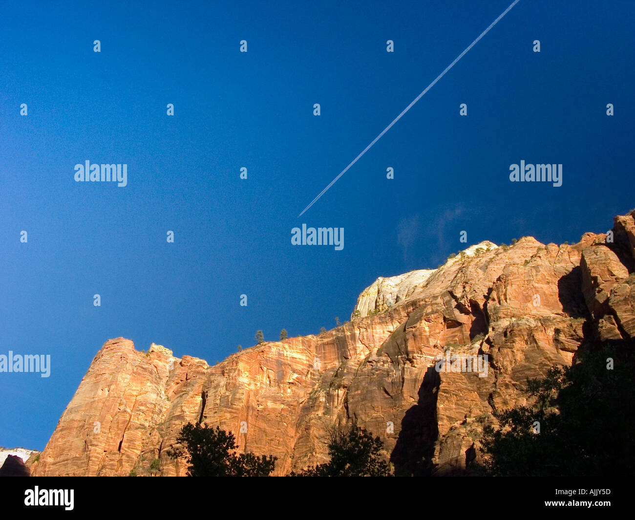 Contrail over Zion national park Utah USA Stock Photo