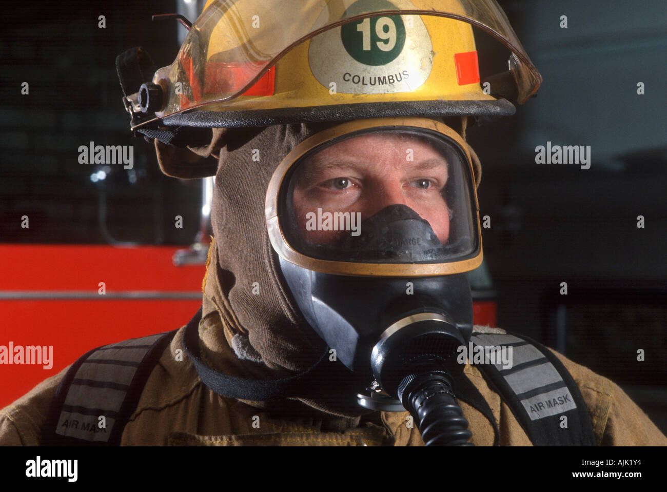 Firefighter in protective gear Stock Photo