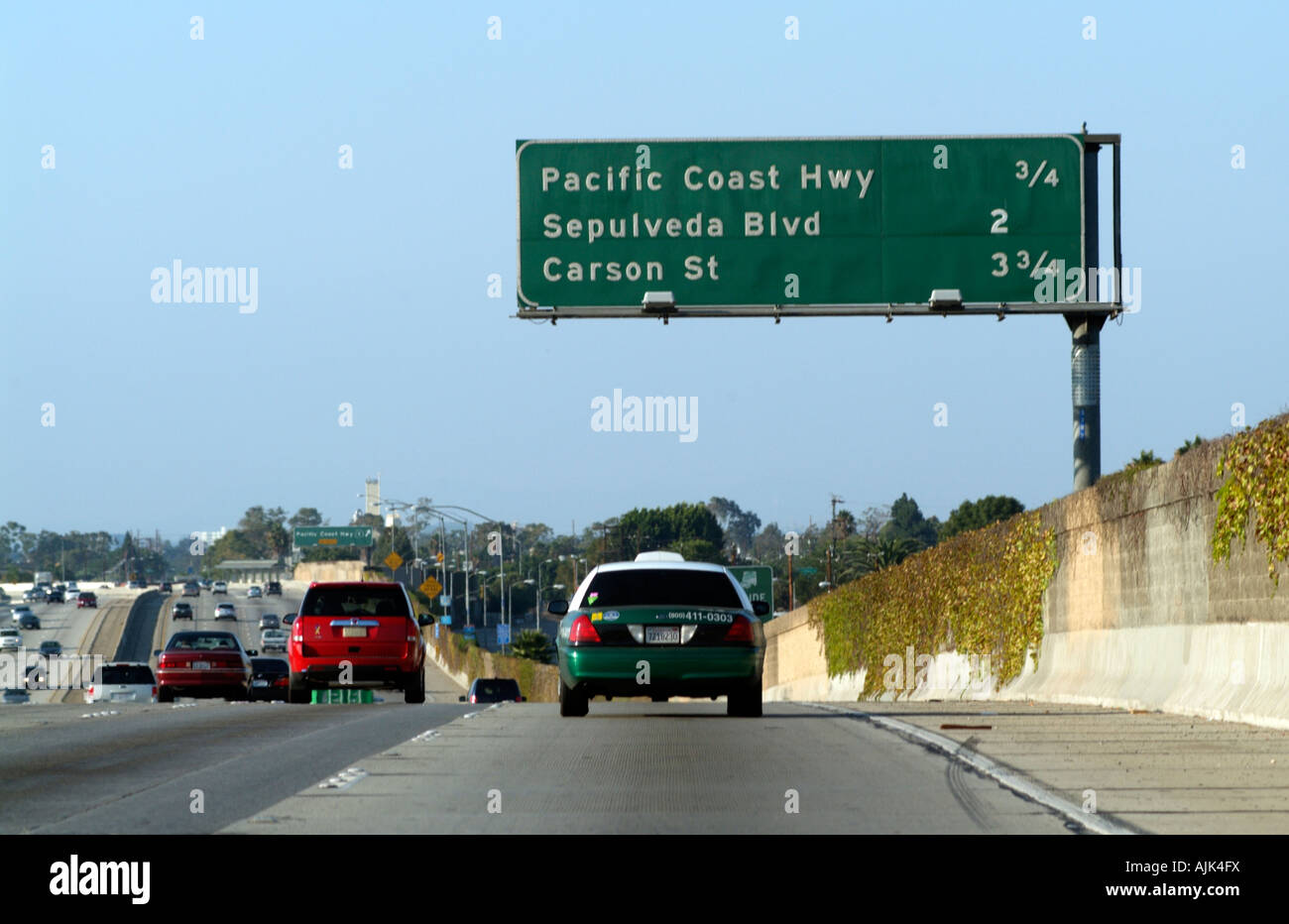 Route 110 Harbor Freeway North Los Angeles California USA Green and white cab exits for Pacific