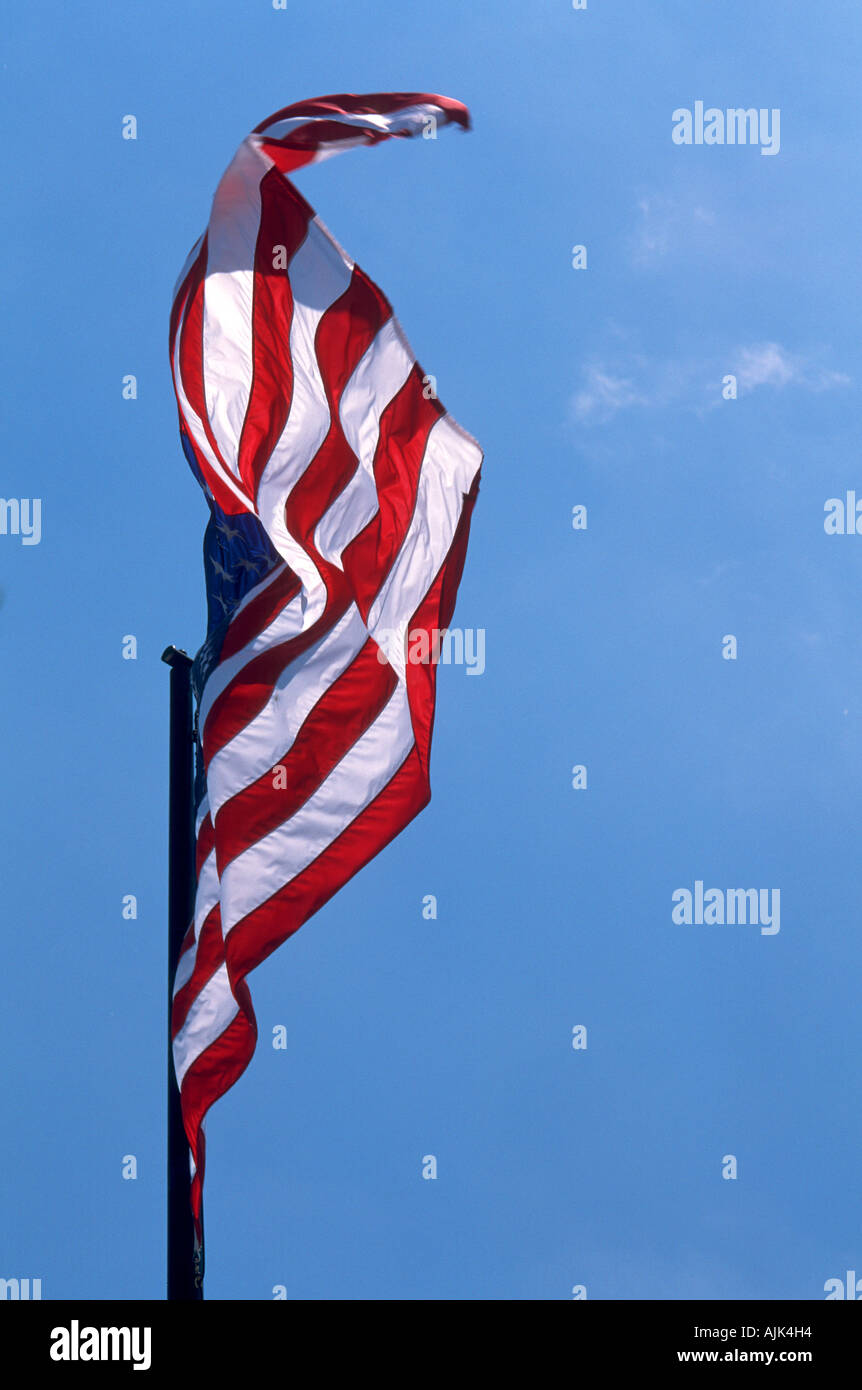 One United States Flag against a blue sky Stock Photo - Alamy