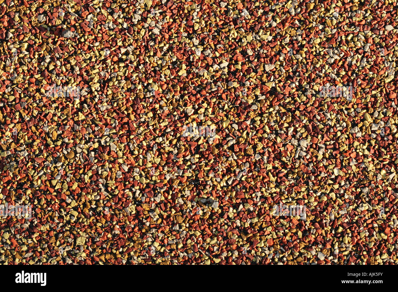 macro shot of colorful gravel pavement orange and yellow Stock Photo ...
