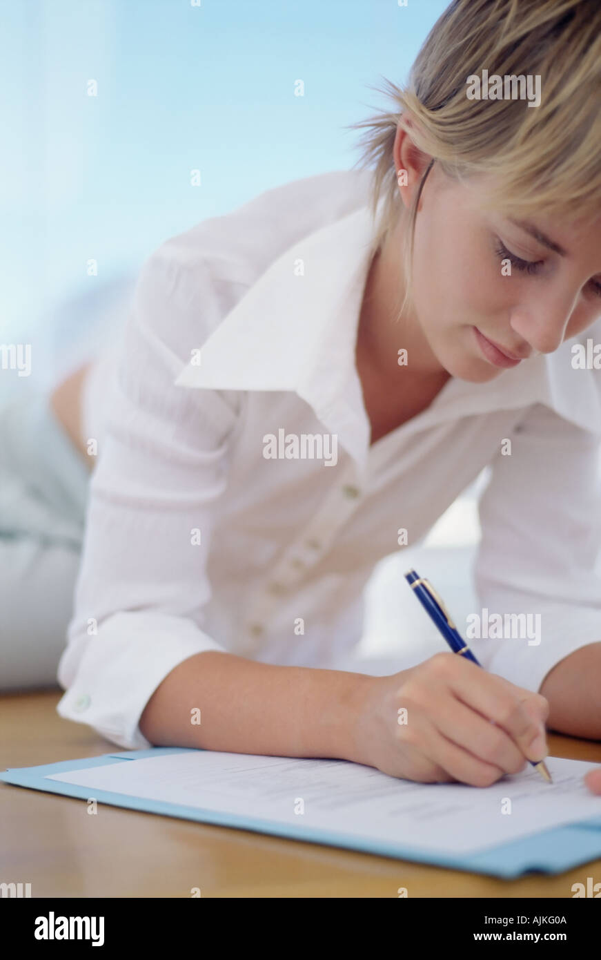 Woman filling in a form Stock Photo