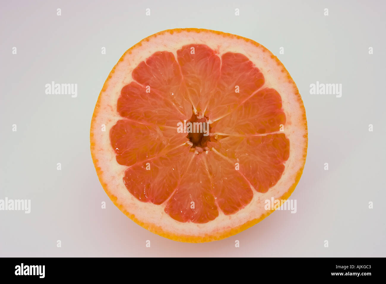 Pink Grapefruit cut into cross section Stock Photo Alamy