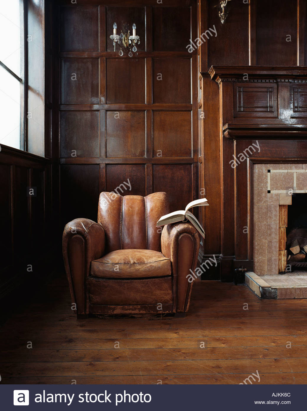 Leather Chair Fireplace Stock Photos & Leather Chair Fireplace Stock