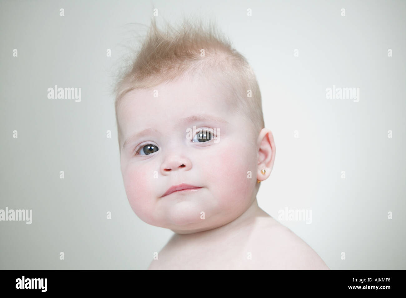 Baby Girl With Spiked Hair Stock Photo Alamy