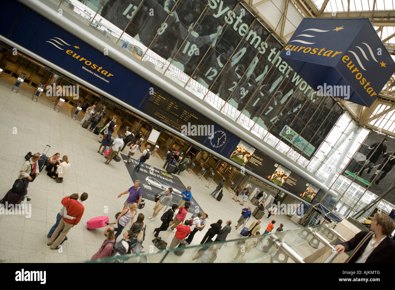 Passengers wait by the old Eurostar terminal in Waterloo train station, London. Stock Photo