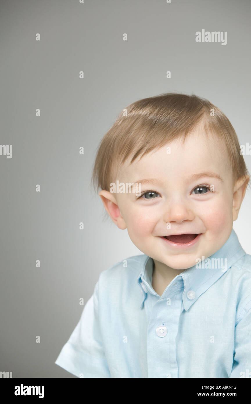 Baby boy wearing a blue shirt Stock Photo