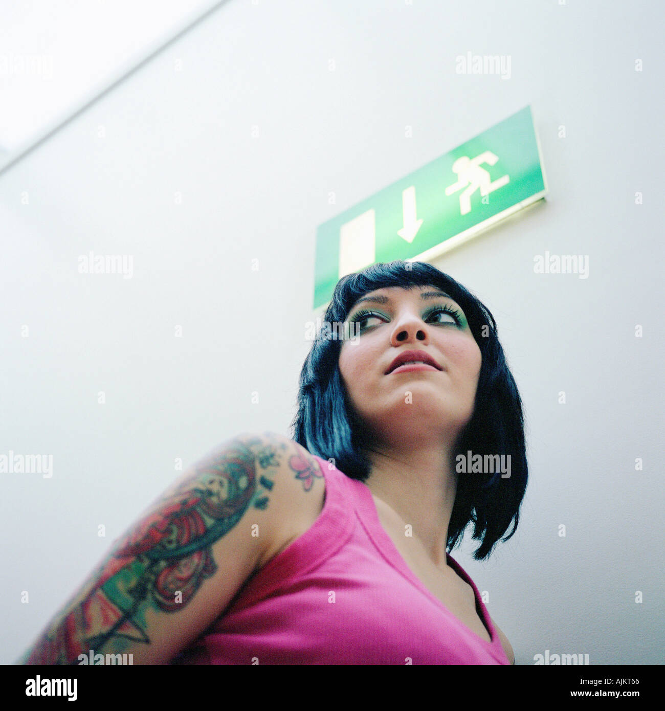 Woman with tattooed arm Stock Photo