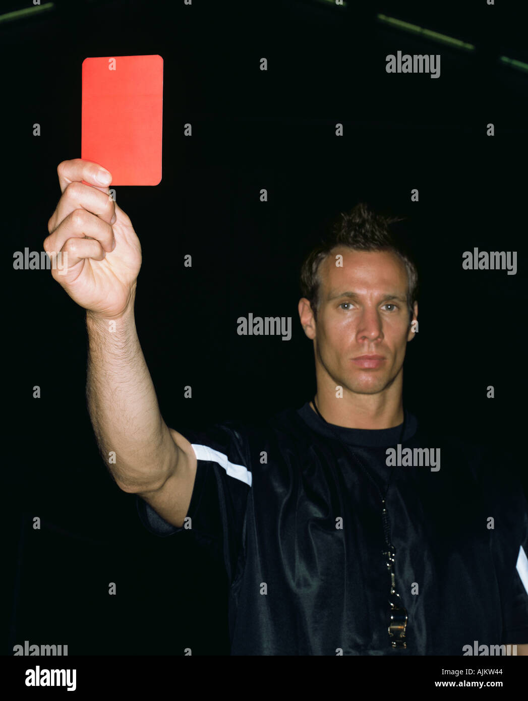 Referee holding a red card Stock Photo - Alamy