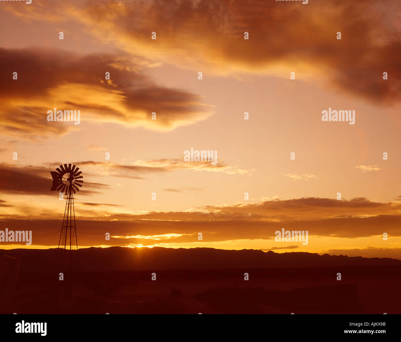 windmill at sunset in Colorado USA Stock Photo