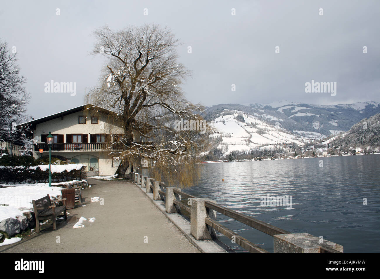 Scenic view of Zeller See lake, Zell am Zee ski resort, with mountains in background, Austrian alps. Stock Photo