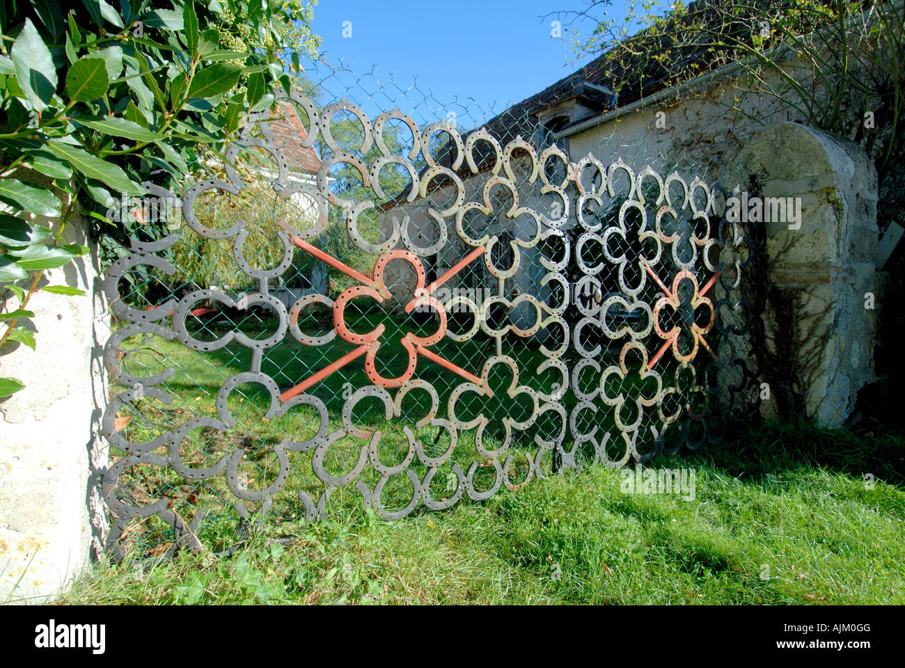 Double garden gates made from more than 120 old horseshoes, near