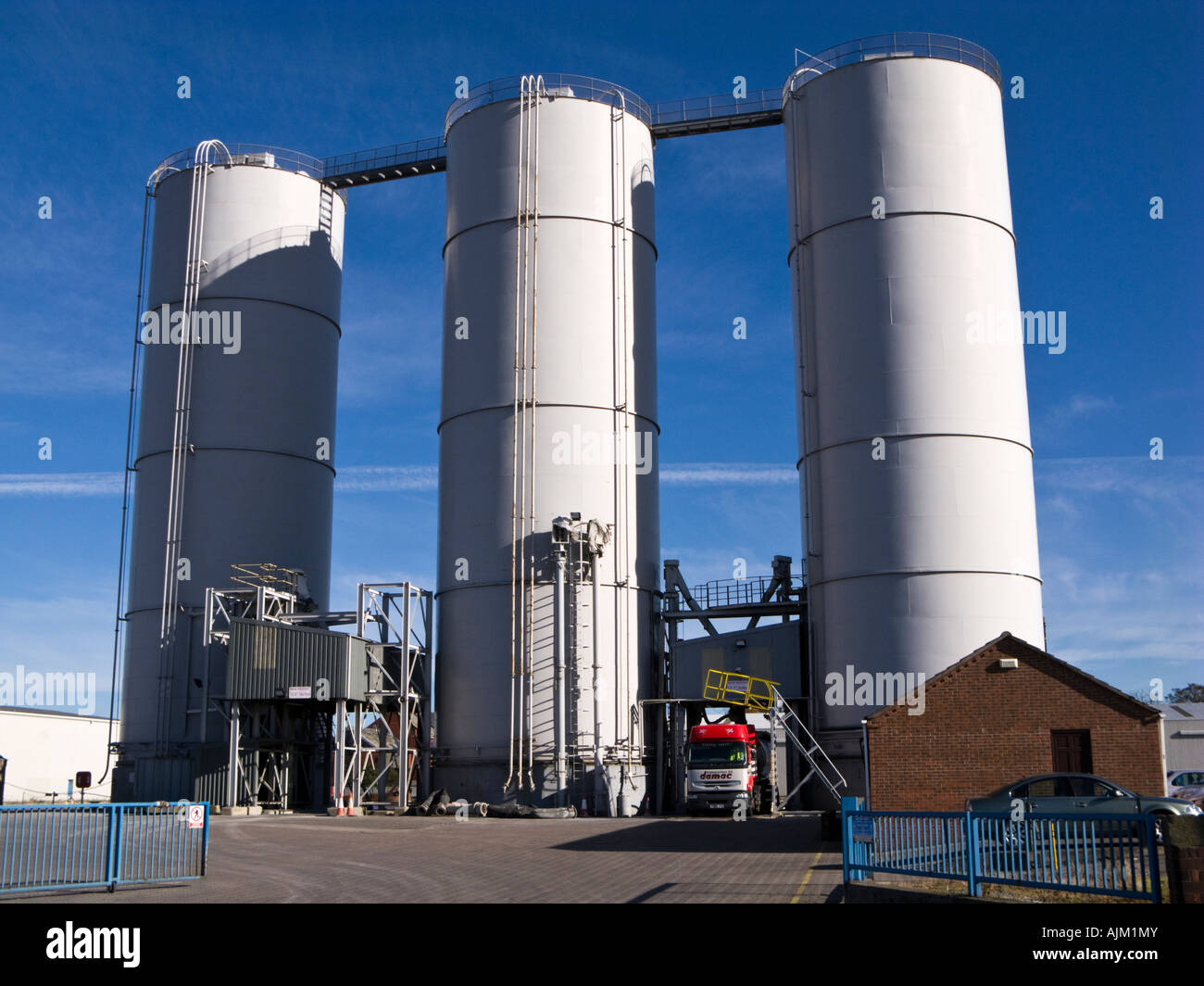 Loading a truck from quayside bulk grain silos at Goole docks, East Yorkshire, UK Stock Photo