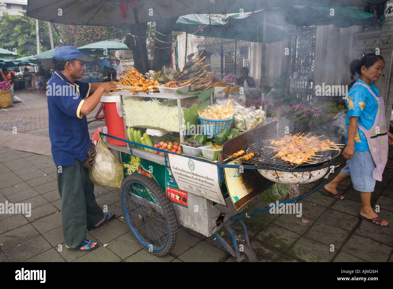 Thailand food street hawker with char-grilled chicken satay Stock Photo