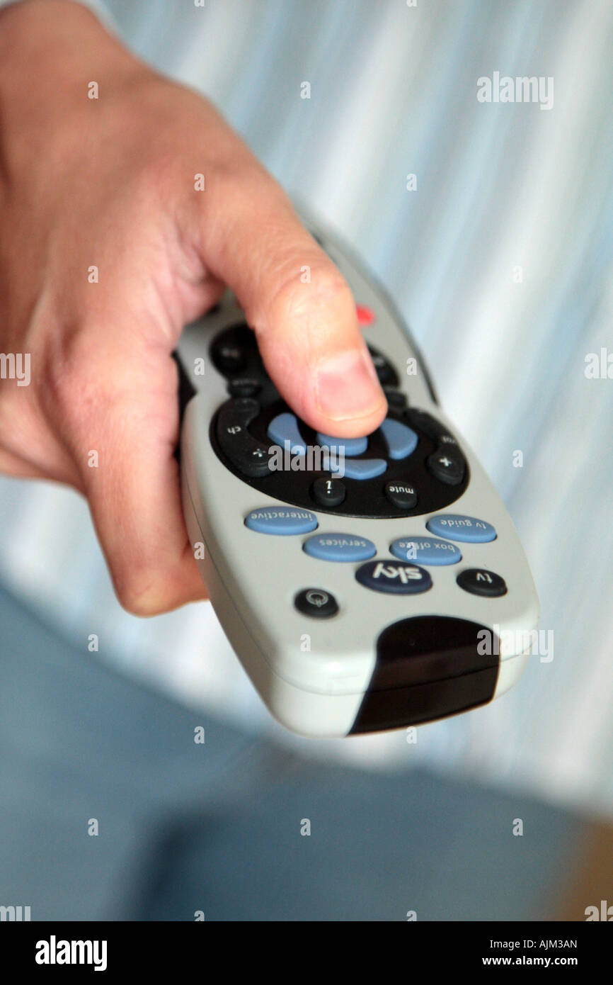 changing channels on TV remote control Stock Photo