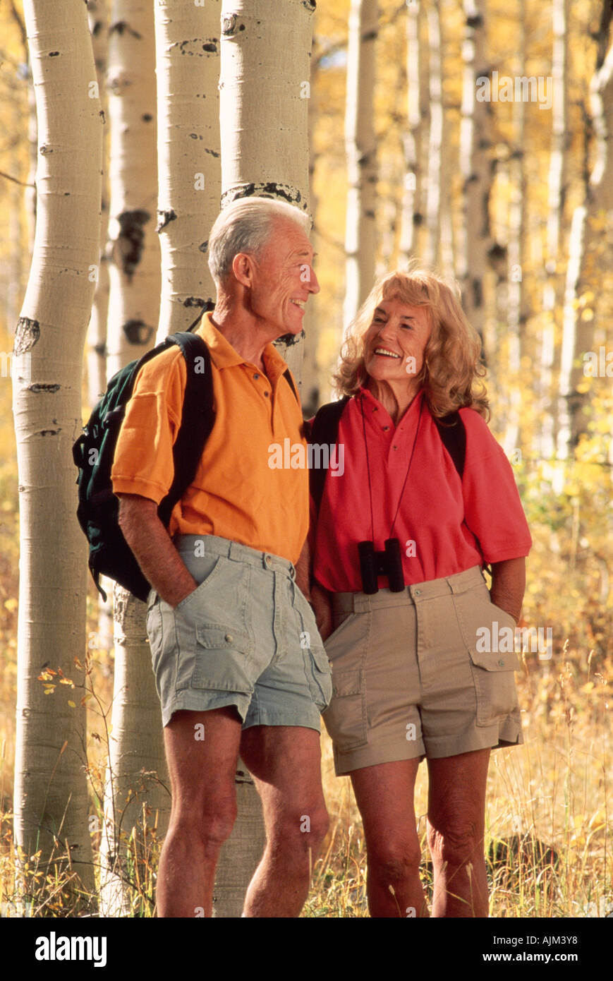 Senior couple pausing amid fall colors Stock Photo