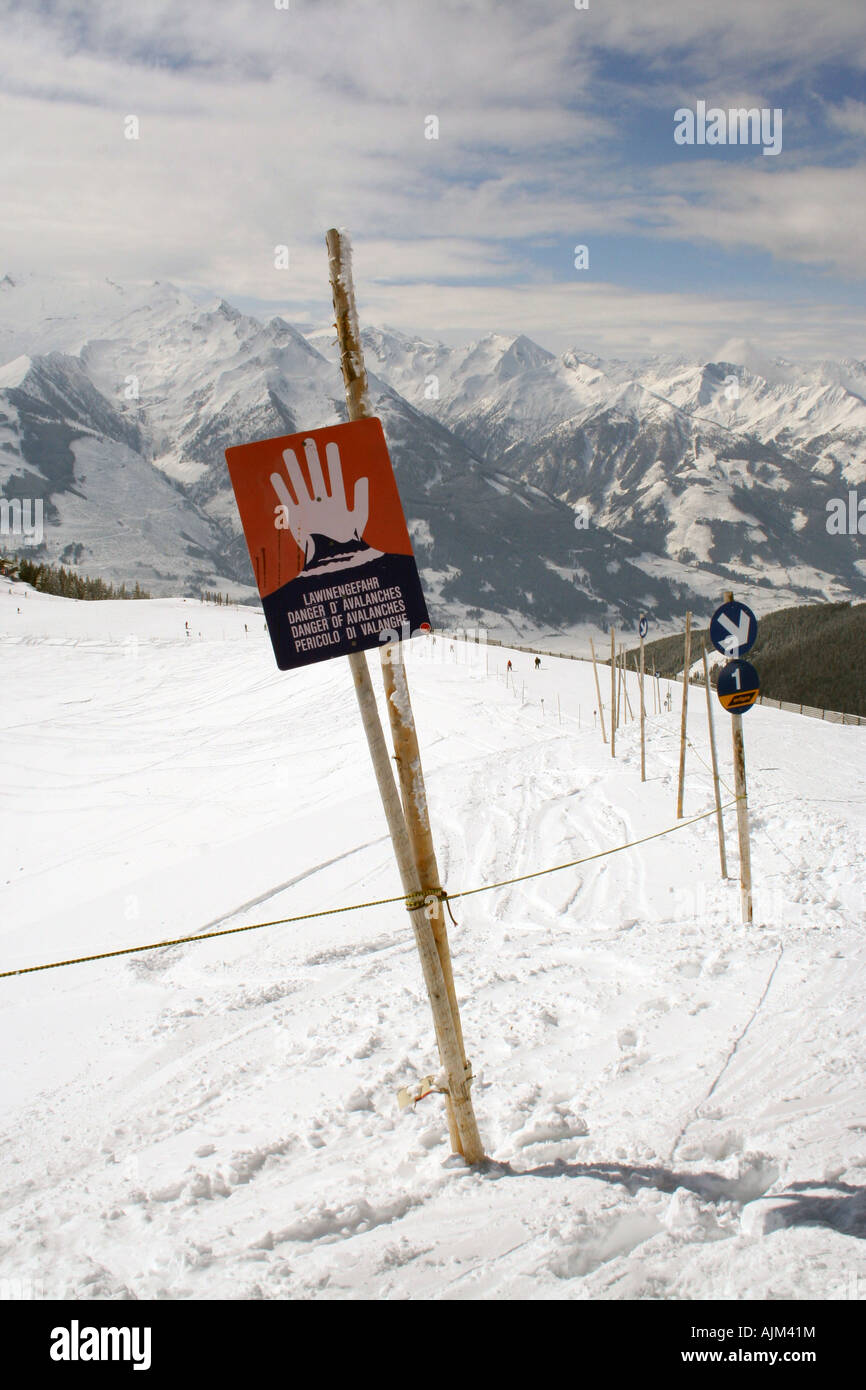 Avalanche warning sign on Schmittemhohe mountain in resort of Zell am See in Austrian Alps. Stock Photo