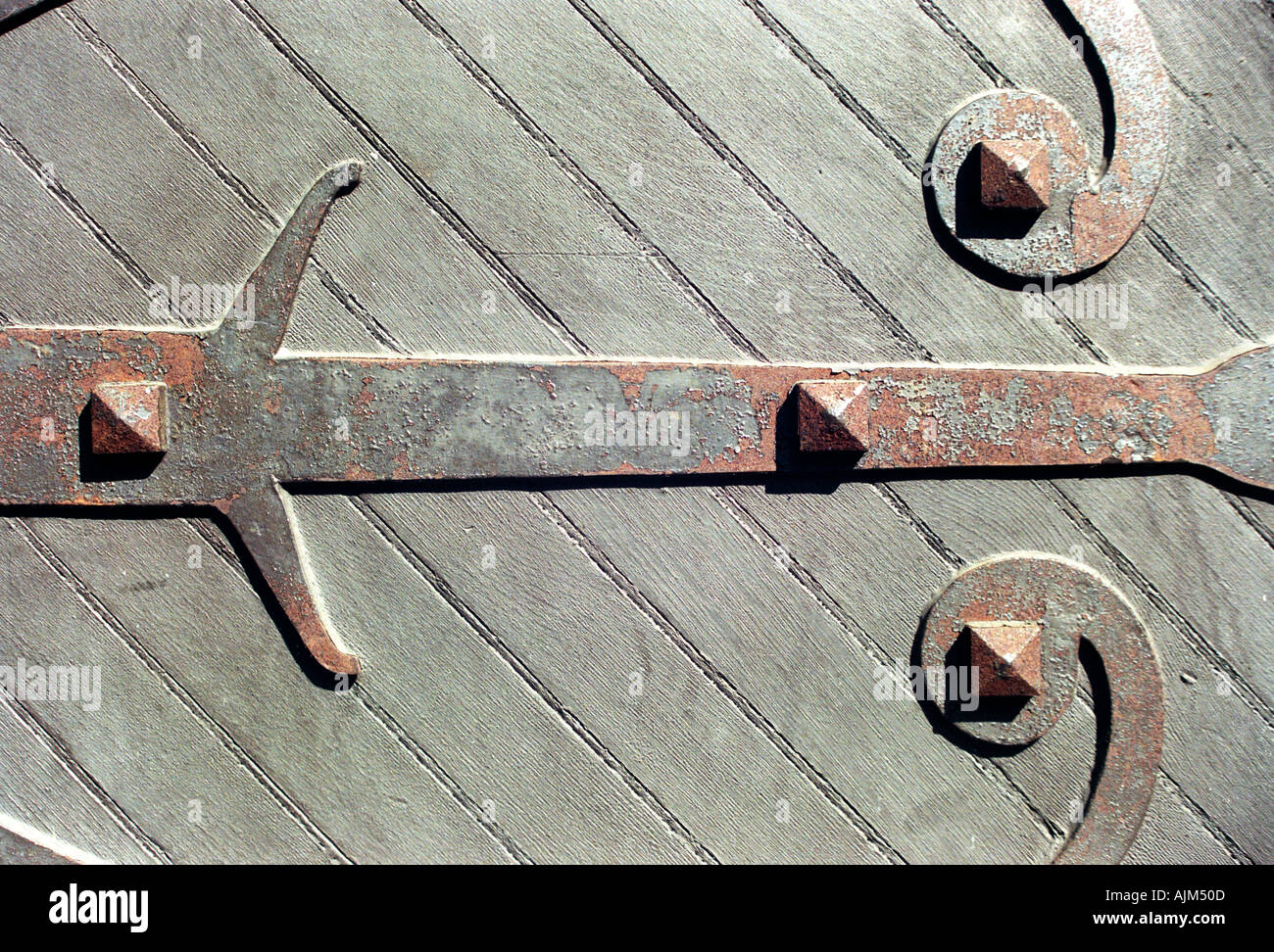 A close up view of a hinge on an old door in Harvard University in Cambridge Massachusetts Stock Photo