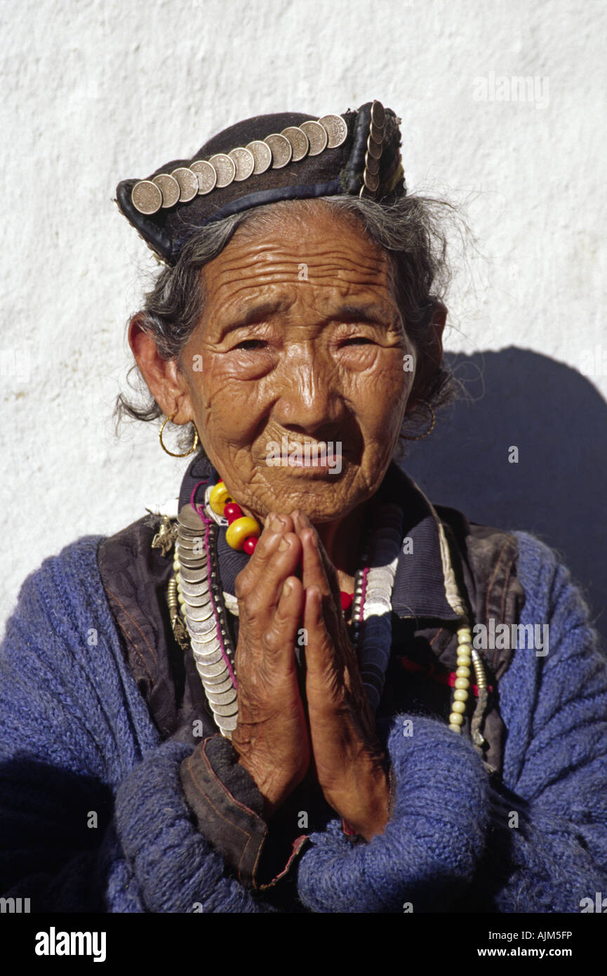 Old Sherpa-woman wears a coin necklace and hat as a symbol of her wealth, Nepal, Himalaya Stock Photo