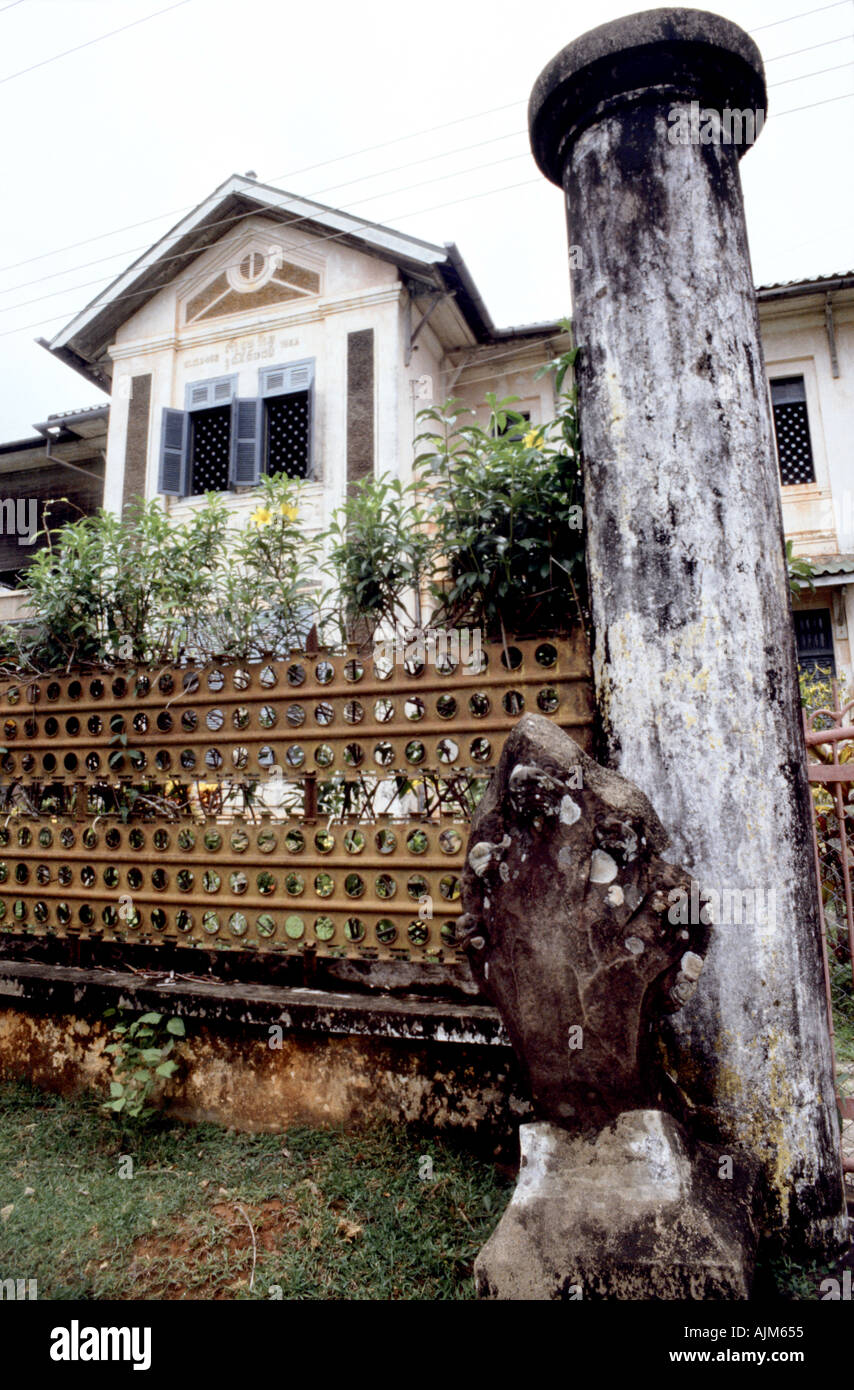 A French colonial house with a protective Buddhist naga at the front at Champasak in southern Laos Stock Photo