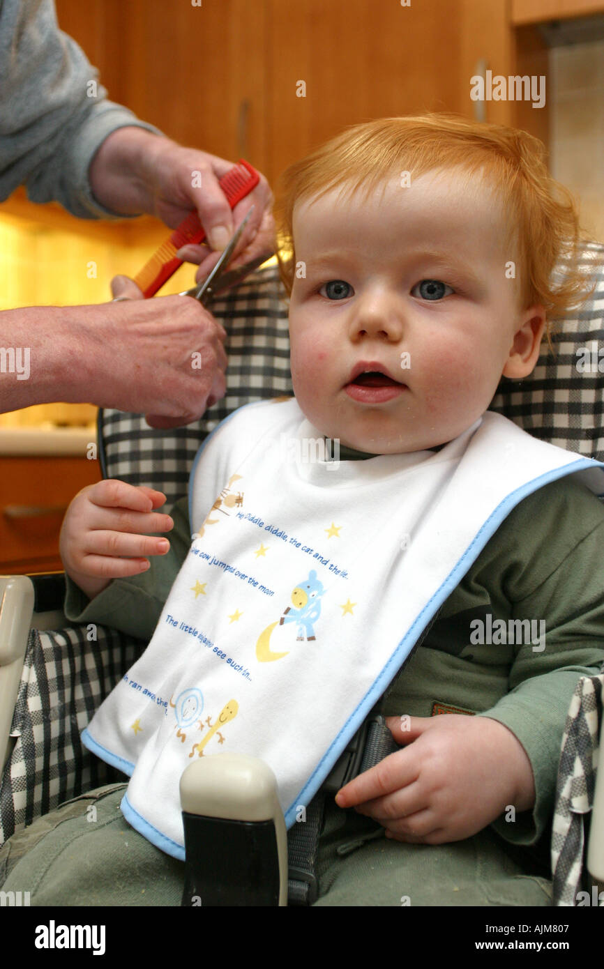 A Baby Having His First Hair Cut Aged 1 One Year Old Stock Photo