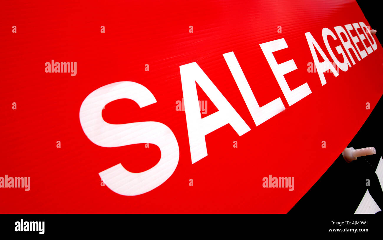 A property for sale agreed sign on a country road in rural Devon Stock