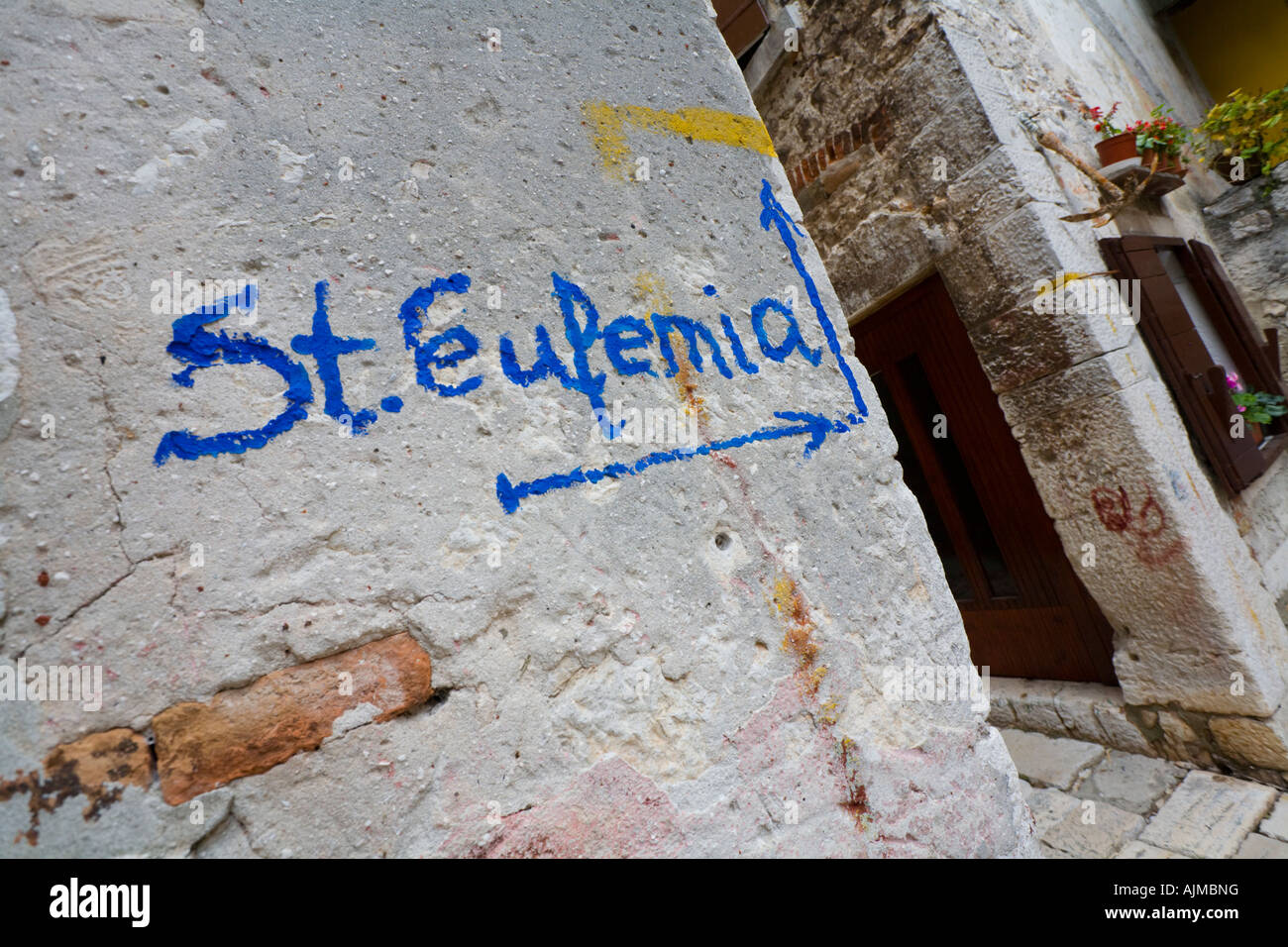 Writing guide on wall leading to St Eufemia cathedral atop Rovinj old town in Croatia Stock Photo