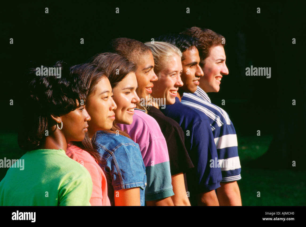 Group of diverse teens lined up in a row Stock Photo