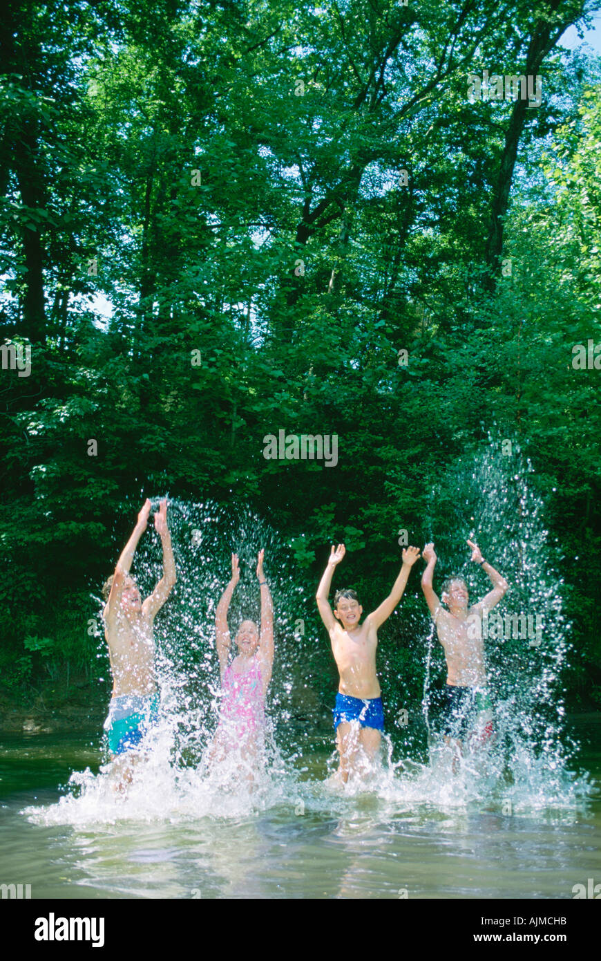 Kids splashing in pond hi-res stock photography and images - Alamy
