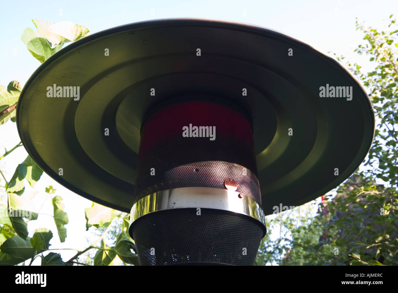 Garden patio heater glowing red calor bottled gas burner Stock Photo