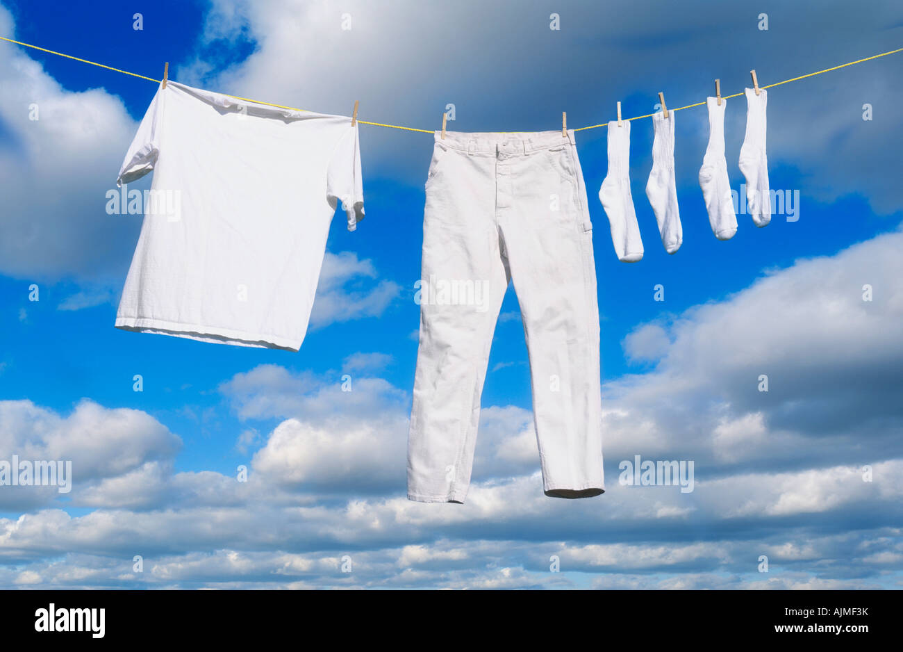 White clothes hanging on clothes line Stock Photo